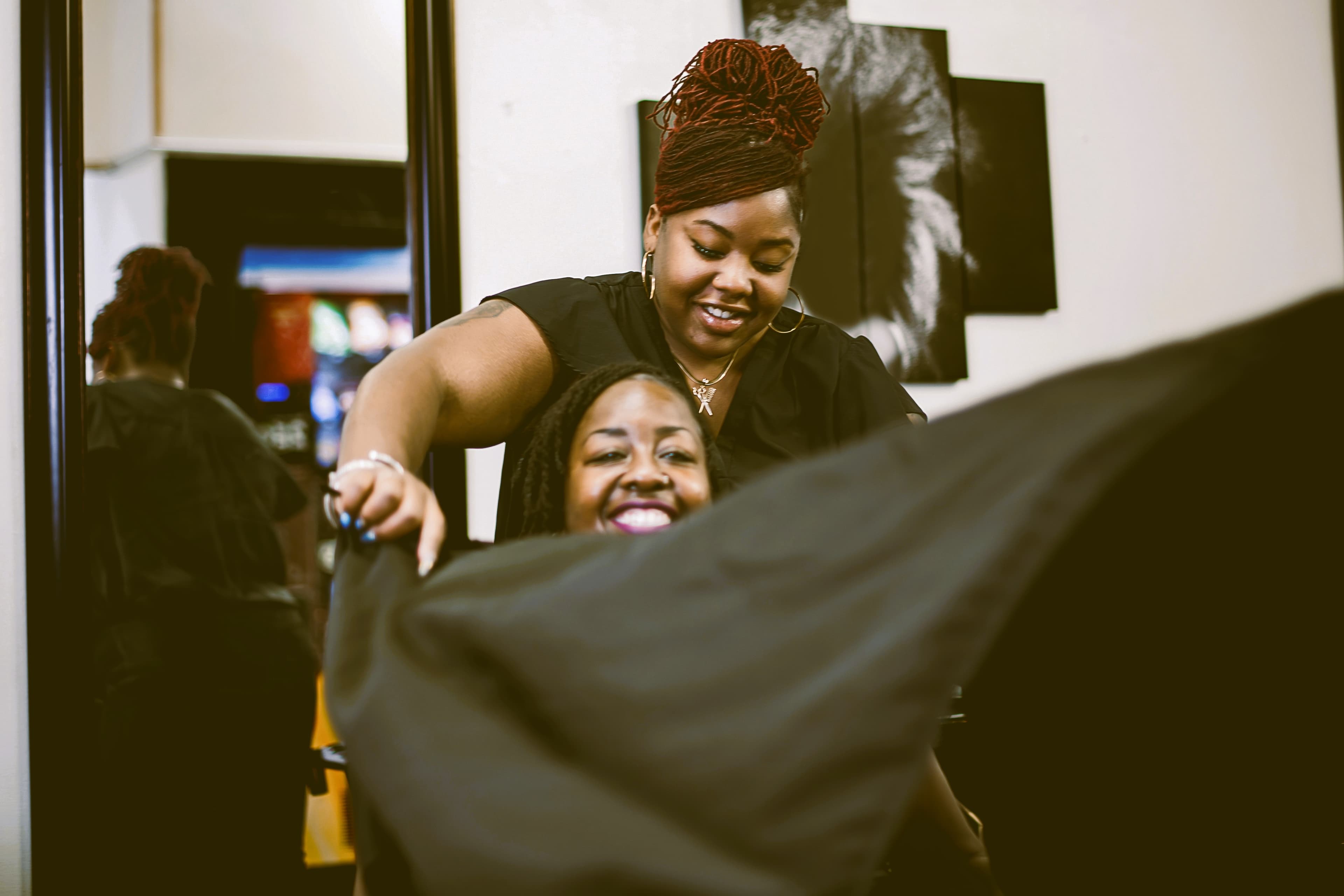 A hairstylist with a client